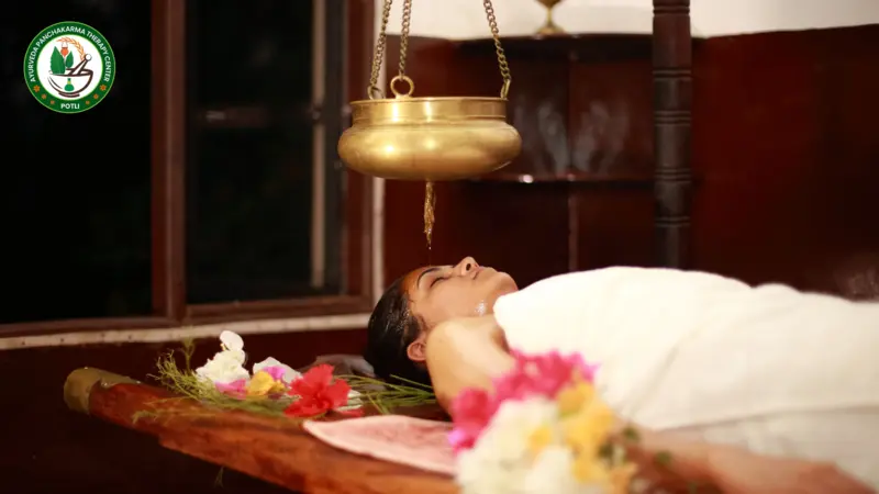 Shirodhara room with dim lighting and calming music